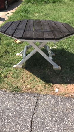 Very nice patio table. Koda stained top and white base with brown distressing