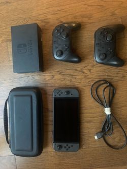 Nintendo Switch with two pro controllers