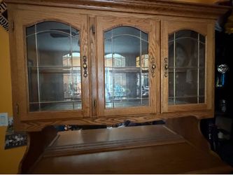 Wooden hutch with glass doors and mirrors