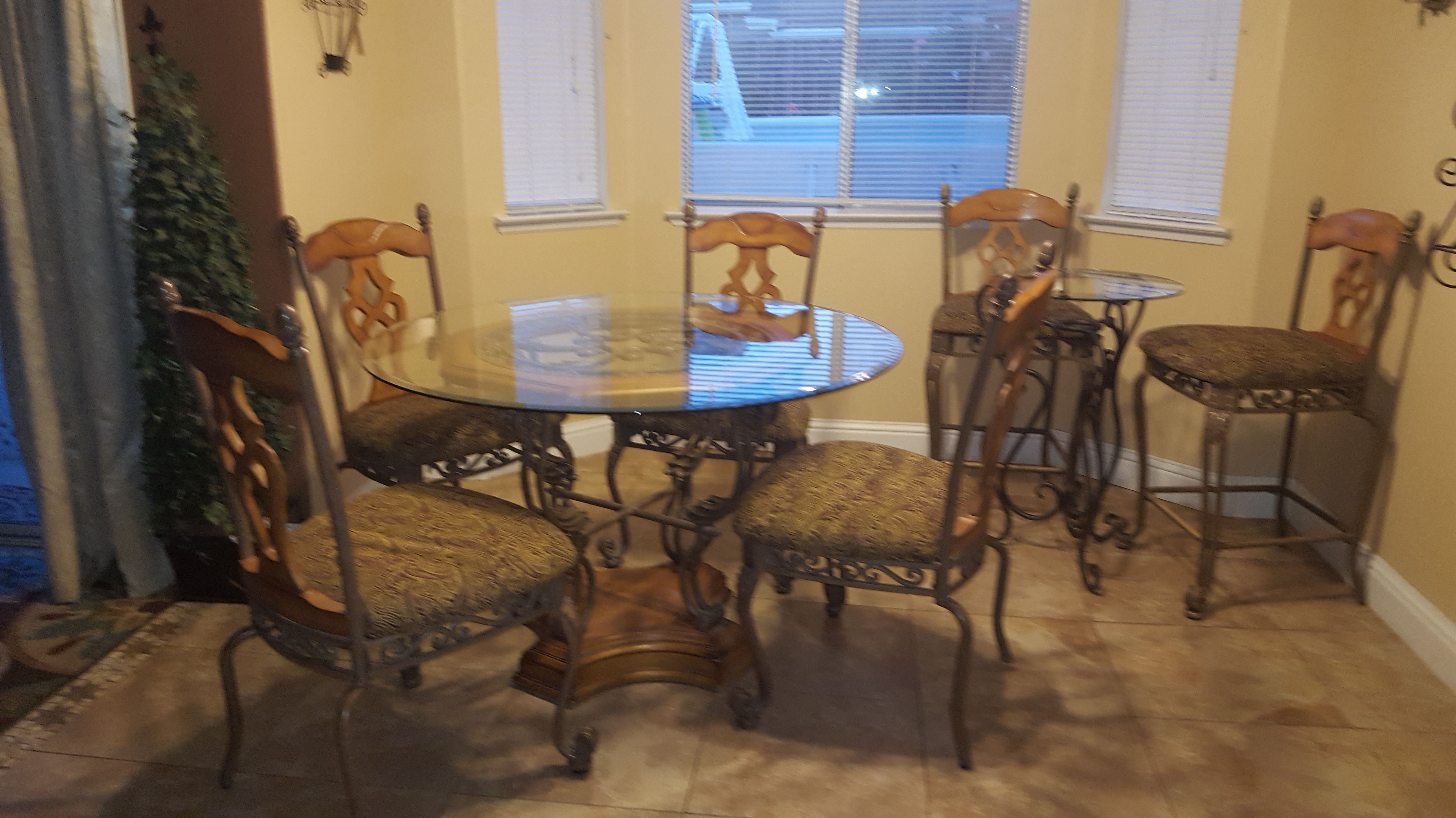 Ashley Furniture Mellenium Santa Barbara Collection Rustic Oak Dining table and high boy with bar stools