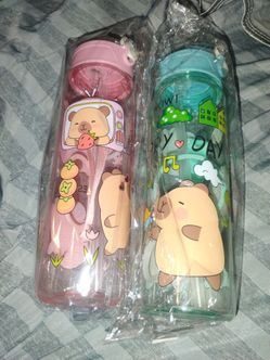 Two cups with a straw boy and a girl