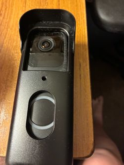 Ring doorbell along with a protective case to protect it from rain