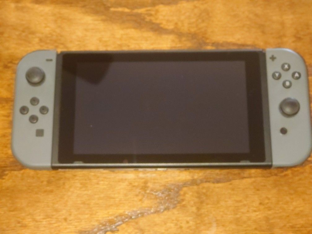 Nintendo Switch With Grey Joycons And Dock