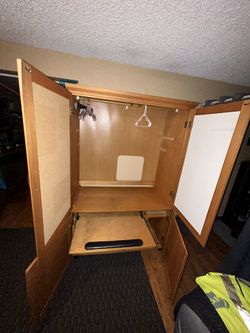 This piece of furniture can be used as a wardrobe or as a computer desk.74”H 46”W. 21”D comes in two pieces.
