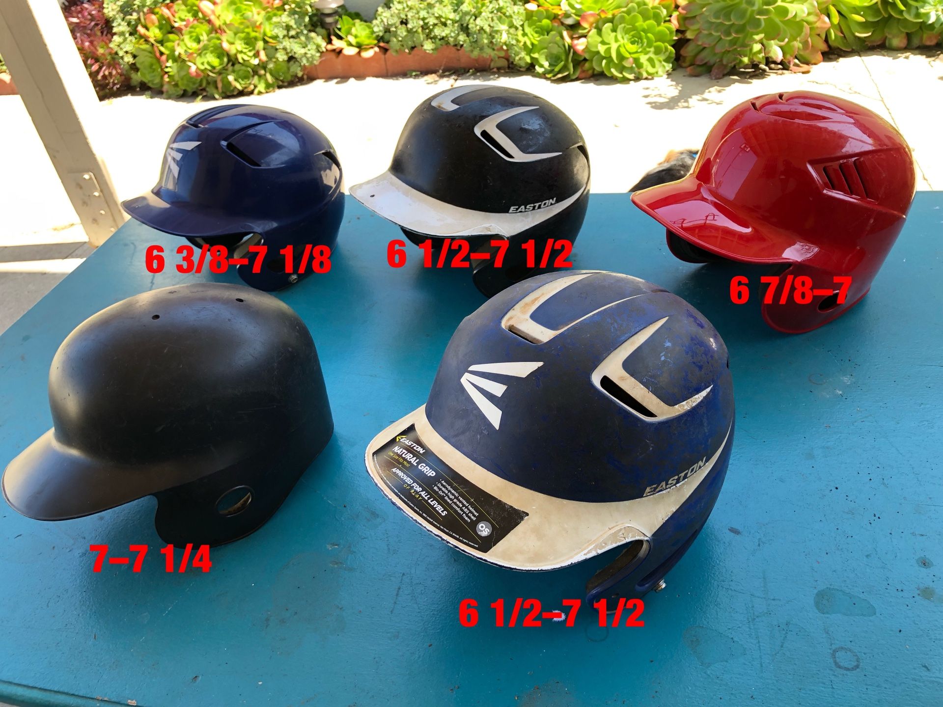 Baseball helmets also have bats gloves and baseball equipment