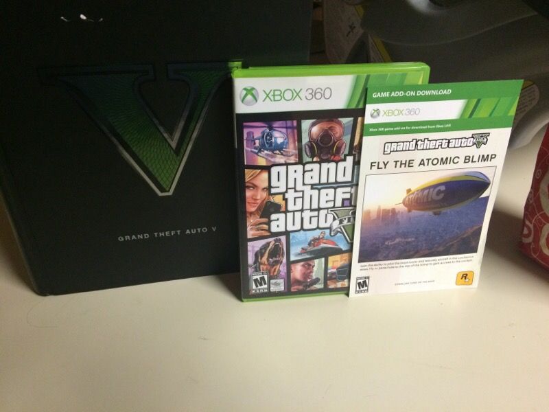 GTA V and limited edition strategy guide w/ atomic blimp DLC