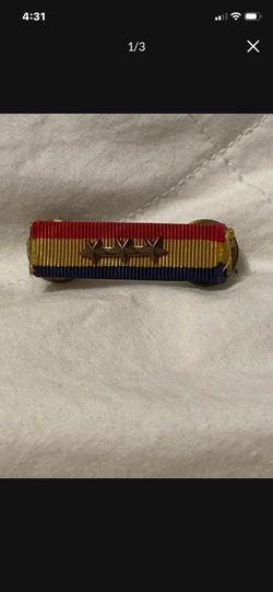 Navy & Marine Corps Overseas Service Ribbon with three bronze service stars indicating a fourth award