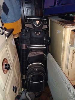 Golf bag carrier black. Minor damage to  the main handle