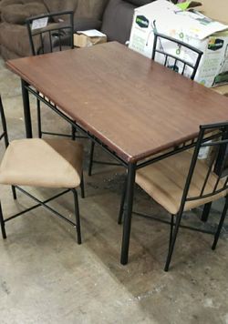 New assembled dining table with 4 chairs