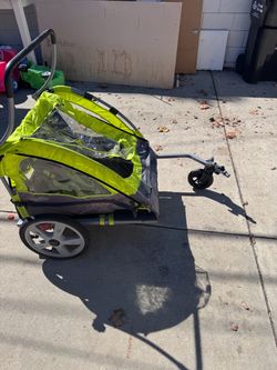 InStep Quick-N-EZ double tow-behind bike trailer carrier.