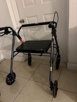 Used Black Rollator Walker with Fold Up and Removable Back Support and Padded Seat