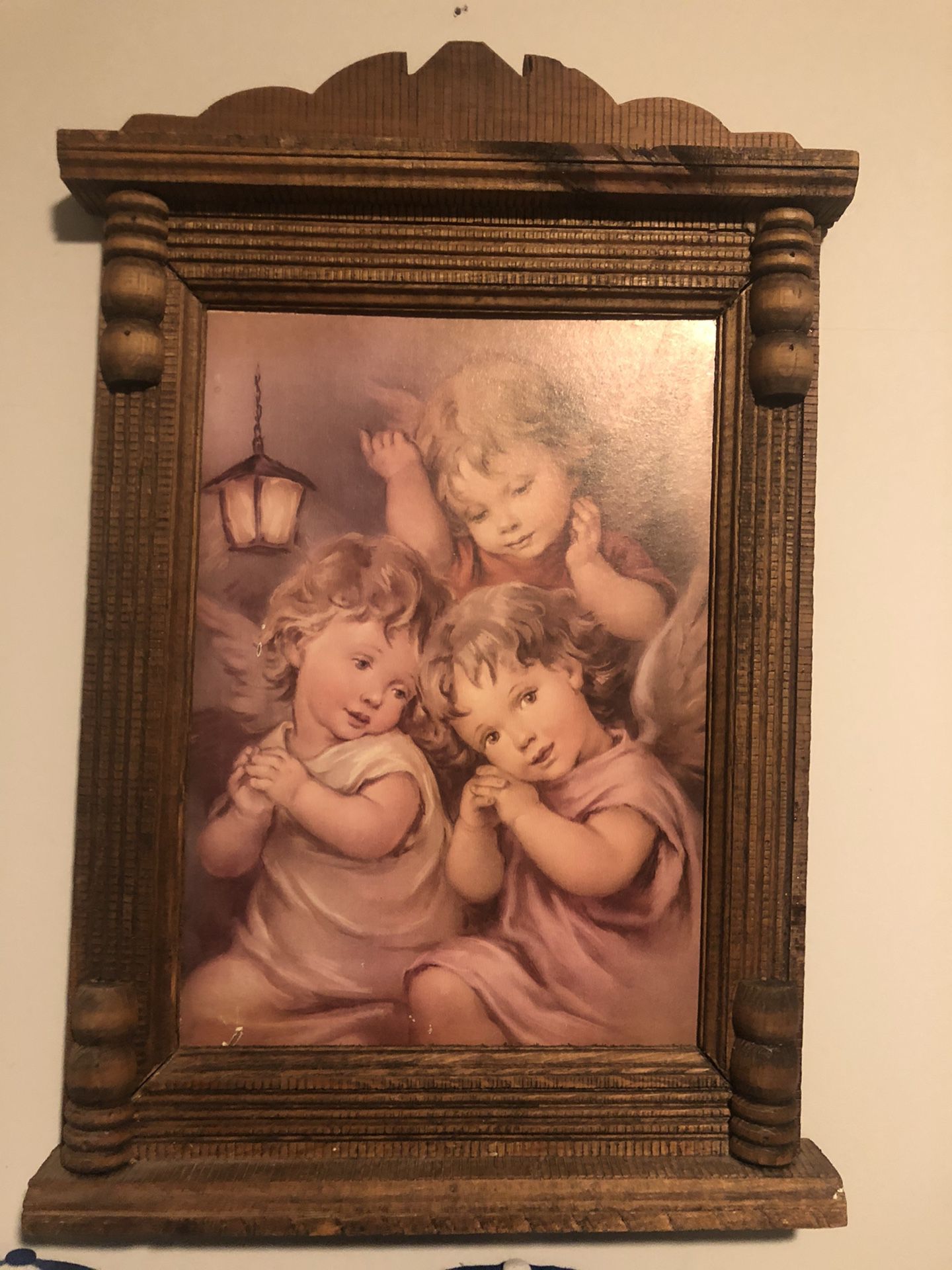 Old wooden angel baby picture