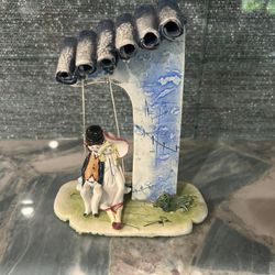 Man And Women Swinging. Pottery By Popular Potter