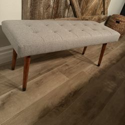 Gray bench 14 inches long 18 inches high 16 inches wide