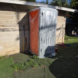 Orange grey porta potties