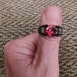 TITANIUM RED GEMSTONE, CZ  RING.  SIZE 12. NEW. PICKUP ONLY