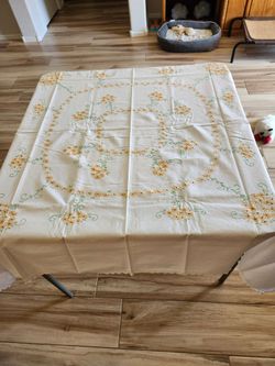 Vintage embroidered tablecloth measuring 51 x 53