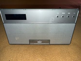The RCA RC651-A is a dual alarm clock radio featuring a retractable 30-pin dock for older iPods and iPhones