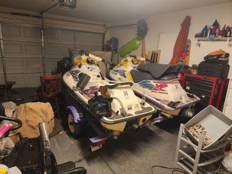 2 sea do skiis and a yacht club trailer