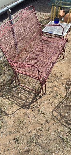 Wrought iron patio furniture... dining table, one small table. A glider swing and chairs