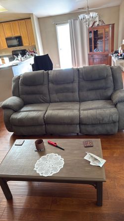 Brown couch with leg rest