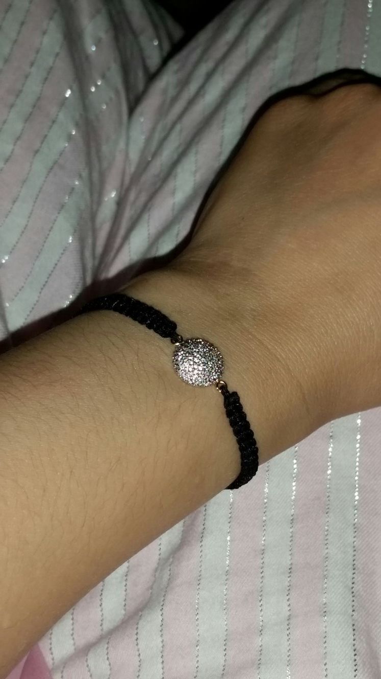 black and silver colored friendship bracelet