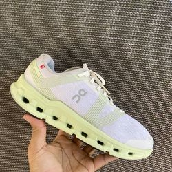 On Running Cloudgo Road Running Shoes in White and Meadow Green.