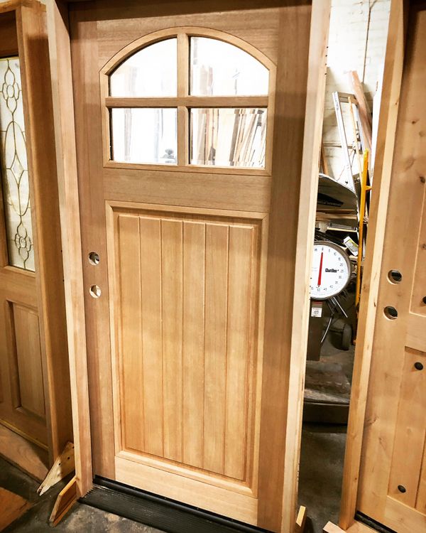 Front Craftsman style design exterior door — wood doors