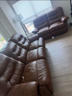 Brown Leather Reclining Sofa and Loveseat Set