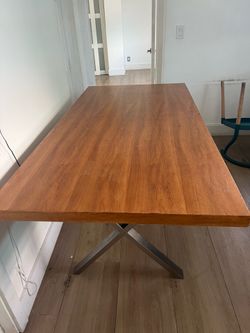 Wood dining table with metal legs