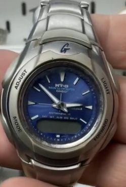 vintage Casio G-Shock MT-G 520 men's watch featuring a blue dial and a stainless steel band