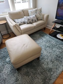 Leather Natuzzi loveseat with ottoman