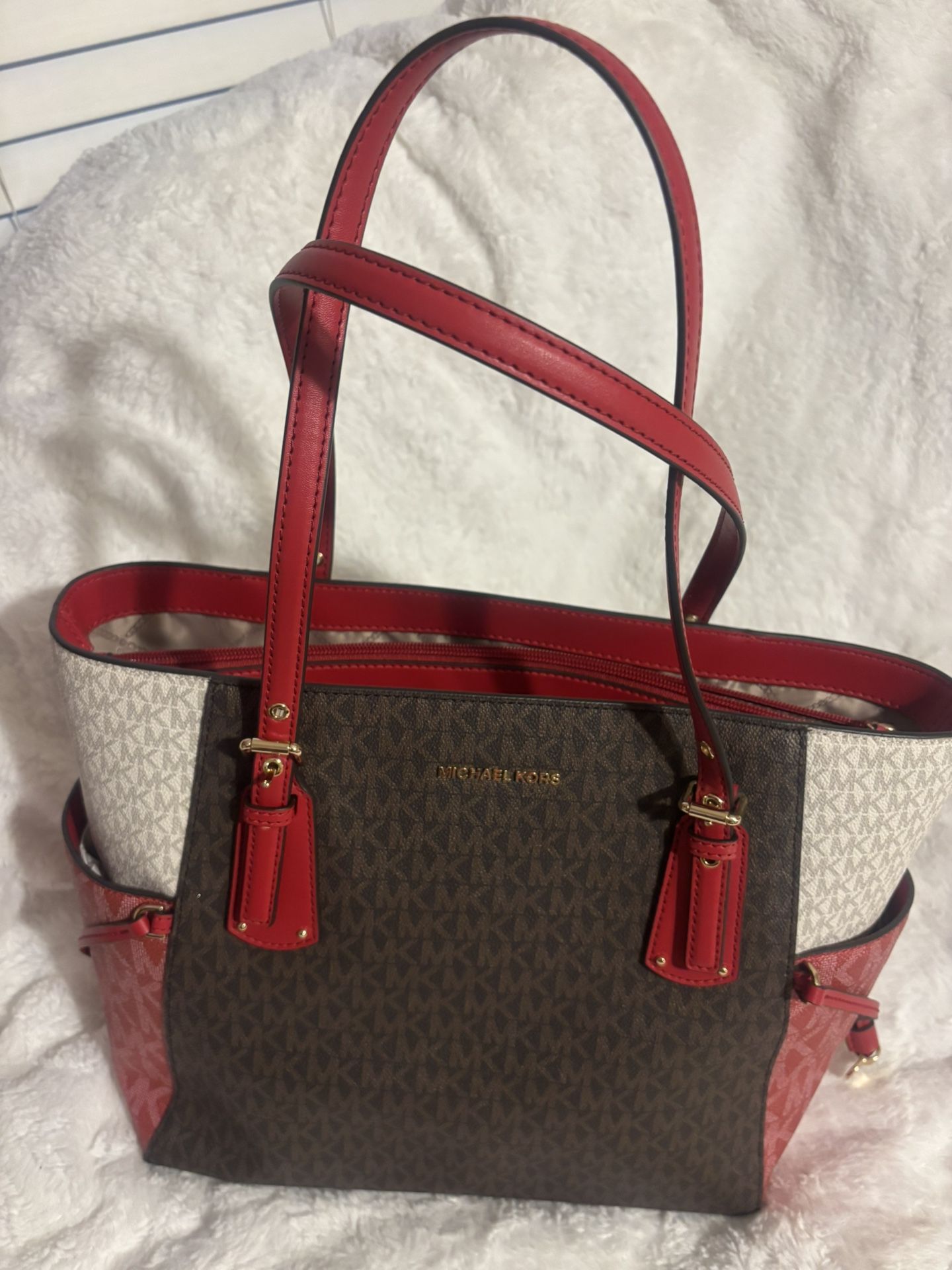 Michael Kors Voyager East/West Signature Tote in the crimson multi color