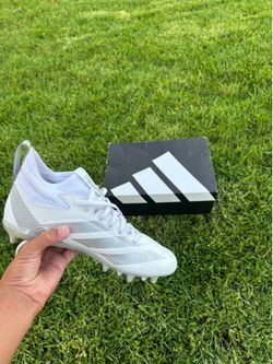 White Adidas cleats, size 8.5 men