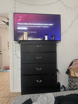 Tv and black dresser