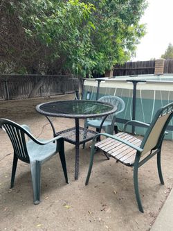 Wicker glass table and chairs