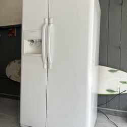 Great working white side-by-side refrigerator freezer