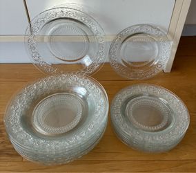 16 piece glass ornate plate set, 8-9” dinner plates, 8-7” salad plates.