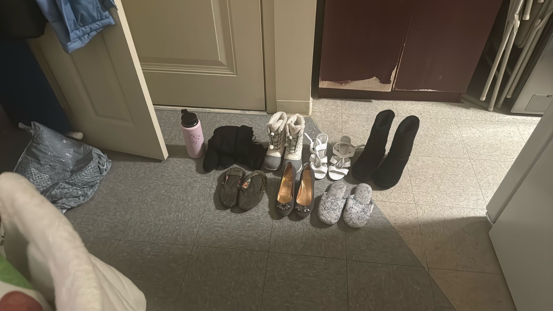 Used Shoes And A Water Bottle