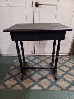 Antique, black wooden side table withdrawer.