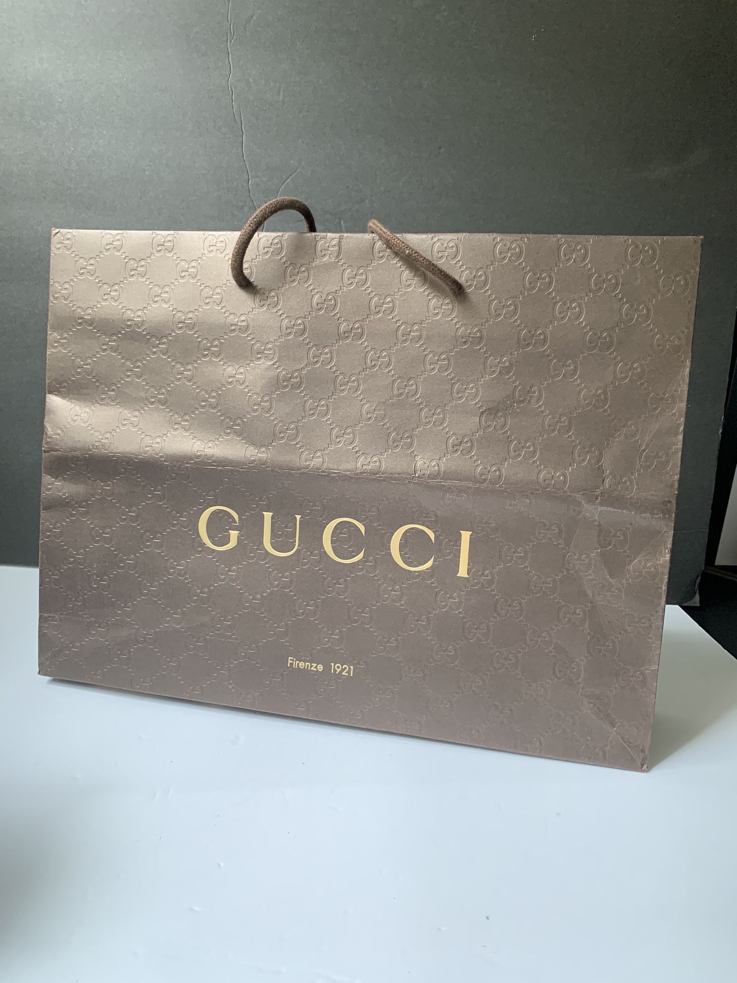 Brown Big Paper Gucci Bag.