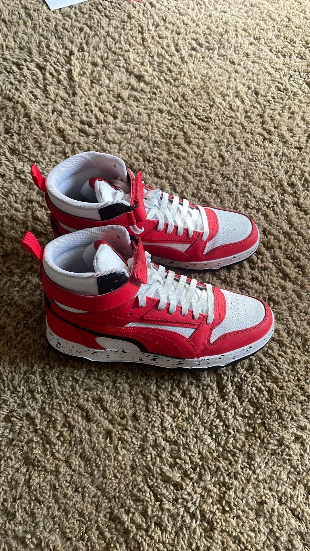 Red And white Puma High tops