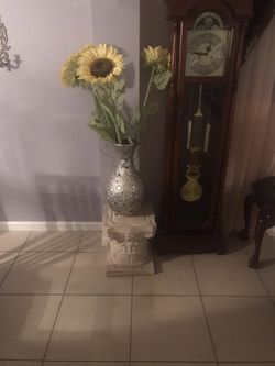Vase with sunflowers and stand