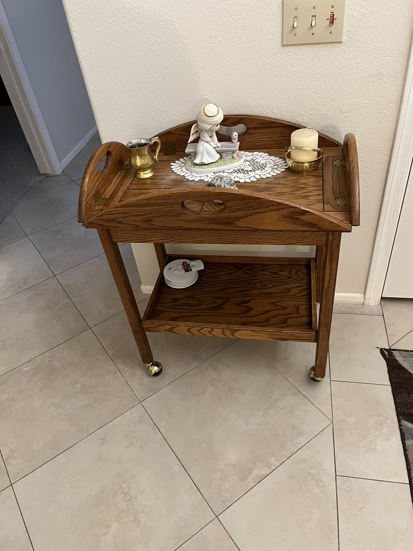 Serving cart with removable top as tray with food on it comes right off just lifting off top handles as a Butler tray