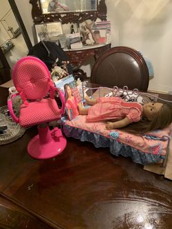 American girl doll , her bed and her chair
