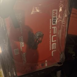 Brand new in the box fuel, Milwaukee, hammer drill and impact gun combo kit