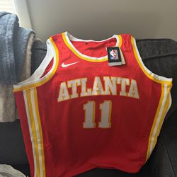 Brand new with tags, Trae Young Hawk’s jersey red men’s size large