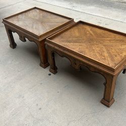 Two Coffee Tables With Glass On Top Of Them