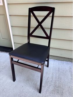 Four folding wood chairs