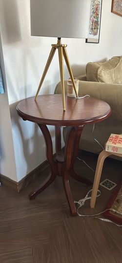 Round dark solid wood side table / nightstand
